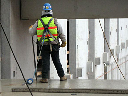 Worker in safety harness